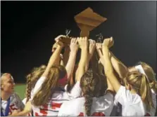  ?? CHRIS DEANTONIO - FOR DIGITAL FIRST MEDIA ?? The Fleetwood girls soccer team lifts the BCIAA championsh­ip trophy after winning the title with a victory over Gov. Mifflin on Oct. 20.