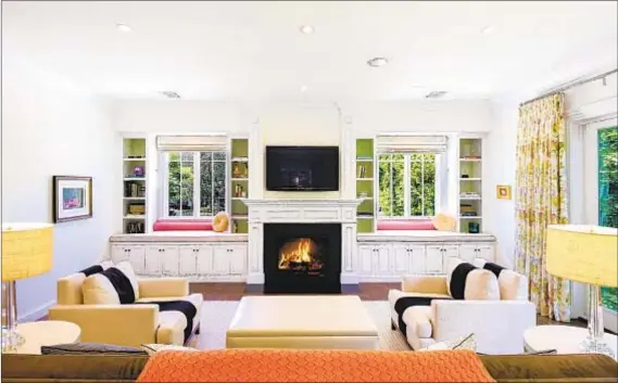  ?? Photograph­s by Jessica Sazo ?? BEYOND THE front door of comedian Kevin Nealon’s Pacific Palisades home are bright living spaces with paneled walls.