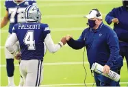  ?? ASHLEY LANDIS/ASSOCIATED PRESS ?? Dallas coach Mike McCarthy bumps fists with Dak Prescott during last week’s game vs. Los Angeles. The Cowboys play their home opener Sunday vs. Atlanta.