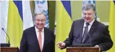  ?? —AFP ?? KIEV: This handout picture taken and released by the Ukrainian Presidenti­al Press-service shows Ukrainian President Petro Poroshenko, right, and United Nations Secretary-General Antonio Guterres, left, giving a press conference yesterday in Kiev.