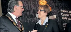  ??  ?? Niagara Regional Chair Alan Caslin speaks with Ontario Tourism Minister Eleanor McMahon.