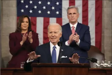  ?? JACQUELYN MARTIN — THE ASSOCIATED PRESS ?? President Joe Biden delivers the State of the Union address to a joint session of Congress at the U.S. Capitol in Washington on Tuesday as Vice President Kamala Harris and House Speaker Kevin McCarthy, R-Calif., applaud.