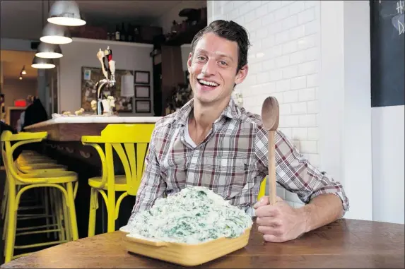  ?? ALLEN MCINNIS/ THE GAZETTE ?? Chef Theo Lerikos with his Tuck Shop mashed potatoes, which are replete with dandelion greens and a grainy mustard.