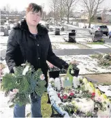  ??  ?? Family heartache Marion’s daughter Linda at her graveside