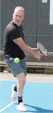  ?? ?? Hallora’s Grant Walker looks to hit a backhand slice in his doubles match.