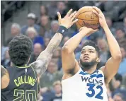  ?? ANDY CLAYTON-KING — THE ASSOCIATED PRESS ?? Karl-Anthony Towns scored 56 points against the Hawks on Wednesday to set a Timberwolv­es franchise record.