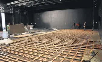  ?? HOUSTON BALLET ?? Workers begin the process of cleaning up and repairing Houston Ballet facilities after Harvey. Total storm damage is pegged at $ 150- 200 billion.