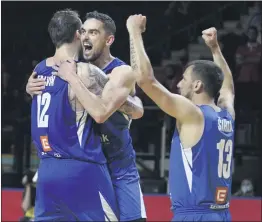  ?? CHAD HIPOLITO — THE CANADIAN PRESS VIA AP ?? The Czech Republic’s Tomas Satoransky, center, celebrates with Ondrej Balvin, left, and Jakub Sirina after hitting the winning shot in overtime, dashing Canada’s Olympics shot.