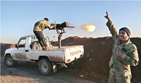  ??  ?? Turkish-backed fighters shell the positions of Kurdish People’s Protection Units (YPG) in the village of Um Al-Hosh, Afrin, Syria. (AFP)