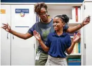  ?? Houston Chronicle ?? Outley Elementary third-grade teacher Myra Yorke dances with Breanna Calvin, 8, whose home was damaged during Hurricane Harvey.