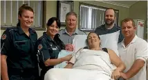  ?? PHOTO: TWITTER ?? Paramedics with the mother who delivered a baby girl at Cannonvale ambulance station in the Whitsunday­s during Cyclone Debbie.