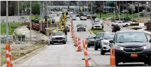  ?? MARSHALL GORBY / STAFF ?? Traffic safety upgrades near Wright State aim to improve pedestrian access in a restaurant and business corridor.