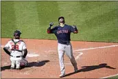  ?? JULIO CORTEZ / AP ?? The Red Sox’s J.D. Martinez reacts after hitting a solo home run off Orioles starting pitcher Tyler Wells during the eighth inning of Sunday’s game in Baltimore.