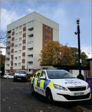  ??  ?? Police at the scene of an ‘unexplaine­d’ death in a Scotstoun block of flats
