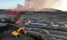  ?? Halldor Kolbeins/AFP/Getty Images ?? Emergency personnel using diggers to build a protective wall to prevent lava reaching the centre of Grindavík on Sunday. Photograph: