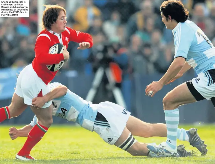  ??  ?? Shane Williams, left, is challenged by Lucas Borges and Juan Martin Hernandez of Argentina during the 2006 Test in Puerto Madryn