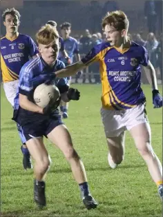  ??  ?? Finn Ryan of St. Anne’s is tackled by Michael Dundon.