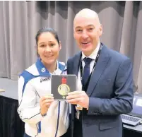  ??  ?? Gold Louise Renicks with head teacher John Robertson Left Miss Campbell after a netball game organised as part of the the Active Girls Day