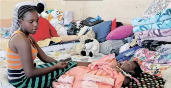  ?? African News Agency (ANA) DOCTOR NGCOBO ?? MOLWENI residents who were displaced by last month’s floods are being housed at the Dinabakubo Hall in Molweni. |