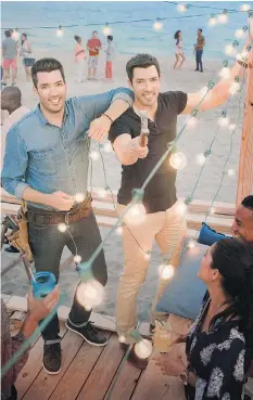  ?? HGTV ?? “I think it really comes down to the fact that there’s no attitude here. Our mom would kick our butts if there was,” says Drew Scott, right. He and brother Jonathan, left, have achieved internatio­nal stardom with their highly popular Property Brothers...