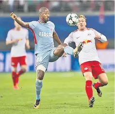  ??  ?? Leipzig’s Emil Forsberg (right) and Monaco’s AlmamyTour­e vie for the ball during the UEFA Champions League Group G match in Leipzig, eastern Germany. — AFP photo