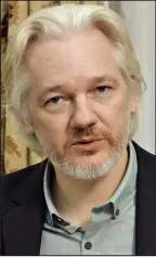  ??  ?? Holed up in embassy: Julian Assange