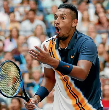  ?? AP ?? Nick Kyrgios can’t seem to believe that Roger Federer has hit his round-thenetpost winner during their third-round match at the US Open yesterday. Federer won in straight sets.