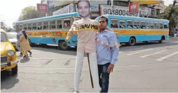  ?? — Reuters ?? A demonstrat­or holds an effigy depicting billionair­e jeweller Nirav Modi during a protest in Kolkata on Sunday.