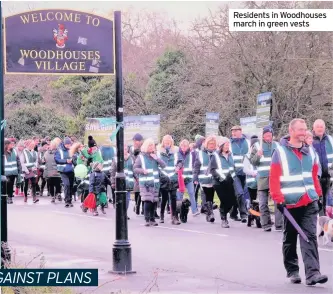 ??  ?? Residents in Woodhouses march in green vests