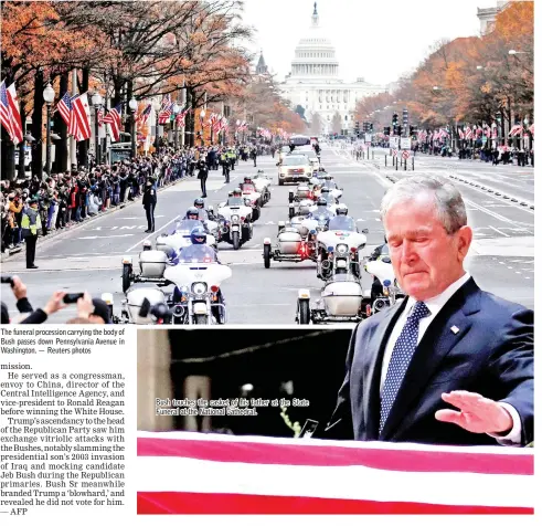  ??  ?? The funeral procession carrying the body of Bush passes down Pennsylvan­ia Avenue in Washington. — Reuters photos Bush touches the casket of his father at the State Funeral at the National Cathedral.