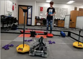  ?? PILOT NEWS GROUP PHOTO/ANGELA CORNELL ?? The Lincoln Middle School team will be hosting a robotics competitio­n showcase in the school gym on on April 13 in the school’s gym. Pictured here is Jonah Rich, the team’s driver, with the robot, Heinz’ Ketchup.