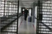  ?? JULIE JACOBSON — THE ASSOCIATED PRESS FILE ?? An officer walks down a hallway at the Rikers Island juvenile detention facility in New York.