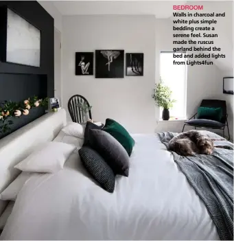  ??  ?? BEDROOM
Walls in charcoal and white plus simple bedding create a serene feel. Susan made the ruscus garland behind the bed and added lights from Lights4fun