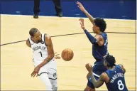  ?? Craig Lassig / Associated Press ?? The Nets’ Kevin Durant (7) passes the ball behind his back during Tuesday’s game at Minnesota.