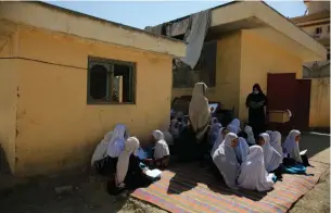  ?? Associated Press ?? ■ This Oct. 7, 2020, photo shows students attending an open air class at a primary school in Kabul, Afghanista­n, An Afghan education ministry memo banning girls, 12 years old and older, from singing at public school functions, which the education ministry tells The Associated Press was a mistake, is causing a social media stir.