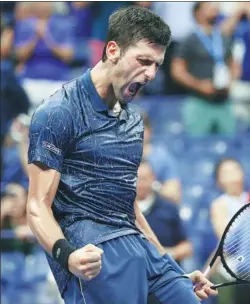  ?? JERRY LAI / USA TODAY SPORTS ?? Novak Djokovic celebrates match point against John Millman in their US Open quarterfin­al at Flushing Meadows, New York, on Wednesday. Djokovic won in three sets to reach the tournament’s semifinals for the 11th time in a row.