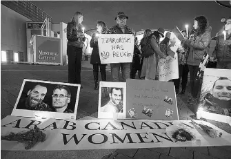  ?? Ryan Remiorz / THE CANADIAN PRESS ?? Mourners including members of an Arab Canadian Women’s group take part in a vigil for slain soldiers Nathan Cirillo and Patrice Vincent on Oct. 28 in Montreal.