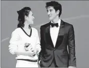  ?? VCG via Getty Images ?? ACTRESS Zhang Ziyi and actor Leehom Wang at the Jan. 9 premiere of “Forever Young” in Beijing.
