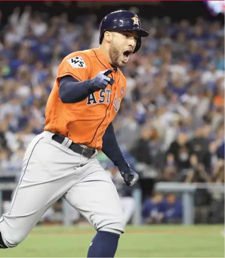  ??  ?? George Springer, who was named World Series MVP, celebrates after hitting a two- run homer in the second inning. | DAVID J. PHILLIP/ AP