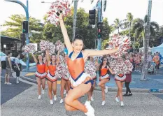  ?? Picture: JUSTIN BRIERTY ?? PARADE OF STARS: Taipans Cheerleade­rs including Maddie Devietti and Taipans Orange Army march from Fogarty Park to Cairns Convention Centre.