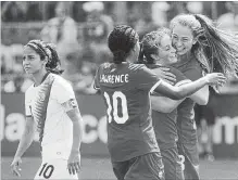  ?? CHRIS YOUNG THE CANADIAN PRESS ?? Canada's Jordyn Huitema, right, celebrates with Ashley Lawrence and Jessie Fleming after scoring against Costa Rica in June.
