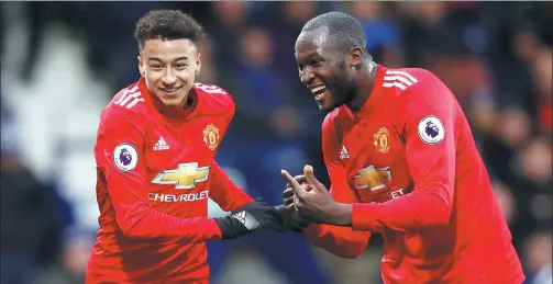  ?? CARL RECINE / ACTION IMAGES VIA REUTERS ?? Jesse Lingard (left) celebrates scoring Manchester United’s second goal with Romelu Lukaku against West Bromwich Albion at The Hawthorns on Sunday. Lukaku also found the net as United won 2-1.