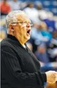  ?? STAFF PHOTO BY DOUG STRICKLAND ?? UTC women’s basketball coach Jim Foster shouts to players during the Lady Mocs’ game against ETSU on Saturday at McKenzie Arena.