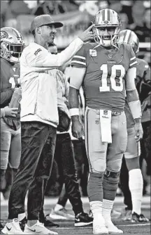  ?? LACHLAN CUNNINGHAM/GETTY ?? 49ers coach Kyle Shanahan, left, and QB Jimmy Garoppalo face the Vikings on Saturday in a divisional playoff matchup.