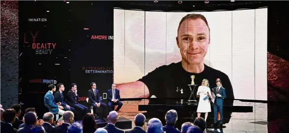  ?? — AFP ?? Count me in: Britain’s Christophe­r Froome is seen on a video screen during the presentati­on of the 2018 Giro d’Italia cycling race in Milan on Wednesday.