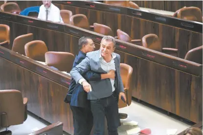  ?? OLIVIER FITOUSSI/AP ?? Legislador­es de origen árabe acusaron a sus colegas de la Knesset de fomentar el racismo.