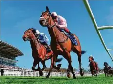  ?? Rex Features ?? So Mi Dar (centre) wins the Investec Derby Trial from (left) Humphrey Bogart at the Epsom Racecourse yesterday.