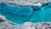  ?? AP ?? Photo shows surface melt water rushing along the surface of the Greenland ice sheet through a supra-glacial stream channel, in South of Ilulissat, Greenland. —