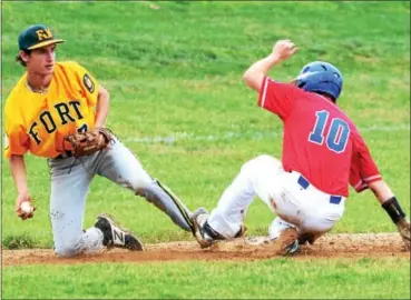  ?? CHRISTINE WOLKIN — FOR DIGITAL FIRST MEDIA ?? Roslyn’s Collin Kelly (10) slides safely into third while Fort Washington third baseman Brian McPeak (7) tries to tag him out during their Lower Montco American Legion Baseball playoff game at Upper Dublin High School on Thursday.