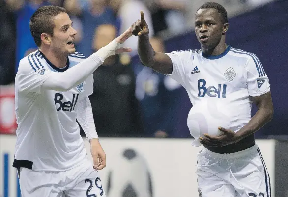  ?? GERRY KAHRMANN/PNG ?? The Vancouver Whitecaps’ Octavio Rivero and Kekuta Manneh celebrate Manneh’s goal in their 2-0 win over the Los Angeles Galaxy at BC Place Stadium last season.